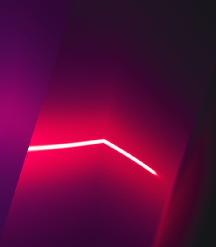 Abstract digital art showing pink light rays representing focus and energy